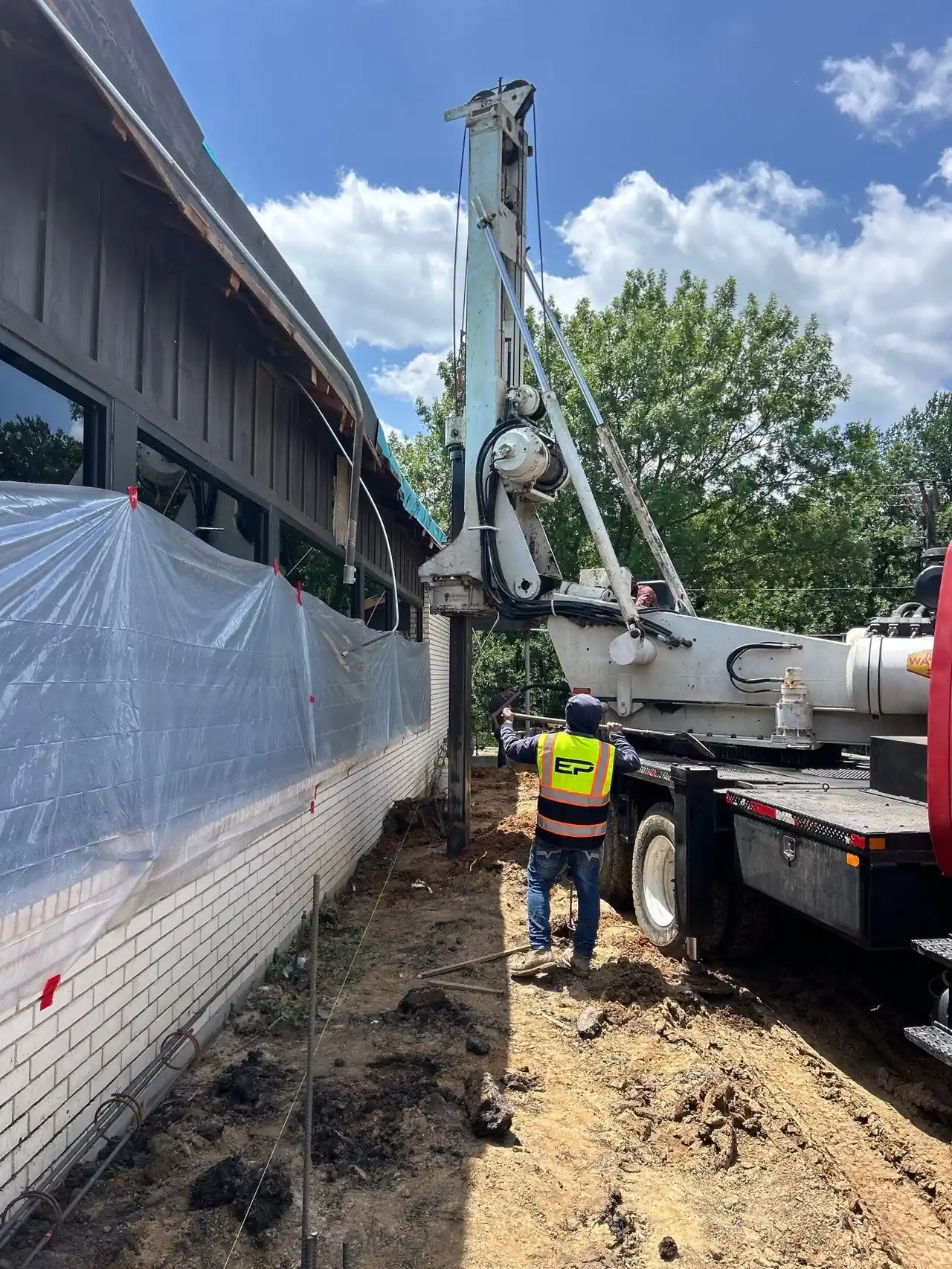 Drilled pier rig operating at a commercial foundation installation