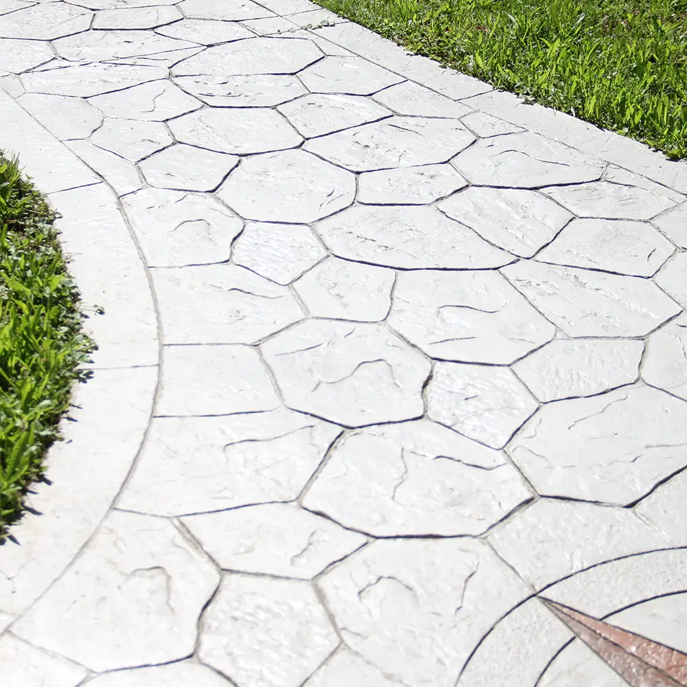 Stamped concrete sidewalk with a patterned surface